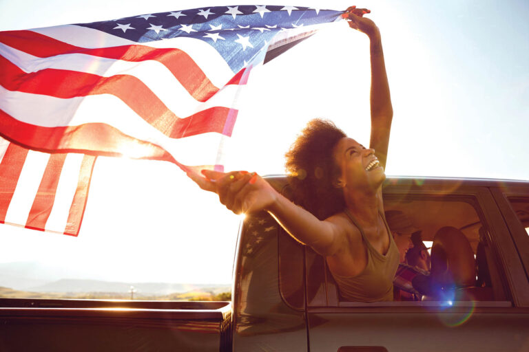 Young friends enjoying the freedom on a Car Trip over a country offroad